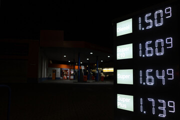 gas station prices signs in the dark