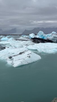 Arctic Fjord with Floating Icebergs in Greenland