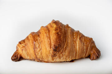 Croissant on a white background, isolate, close-up