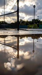 Tennis court puddle reflection
