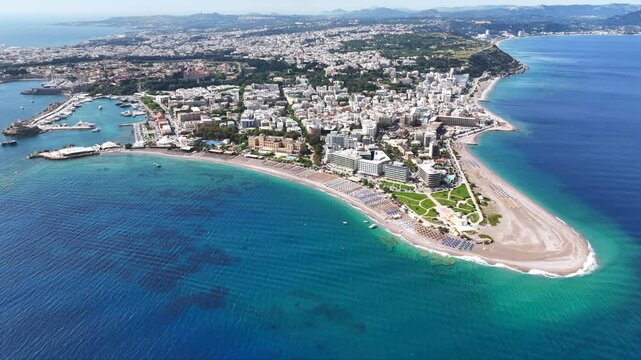 Aerial drone cinematic video of Rodos  or Rhodes island town Elli beach and peninsula a popular summer tourist destination, Dodecanese, Aegean, Greece