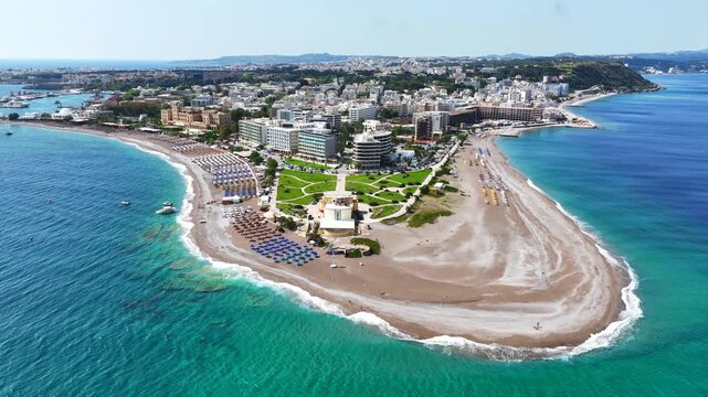 Aerial drone cinematic video of Rodos  or Rhodes island town Elli beach and peninsula a popular summer tourist destination, Dodecanese, Aegean, Greece