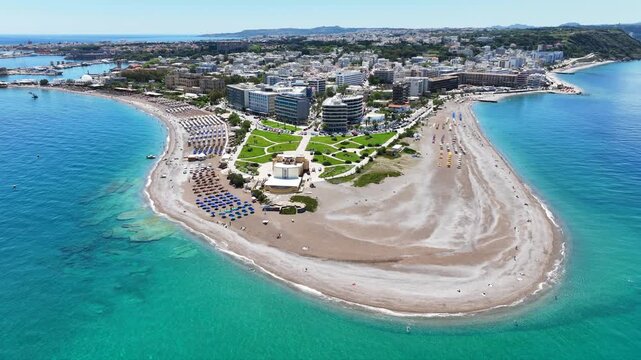 Aerial drone cinematic video of Rodos  or Rhodes island town Elli beach and peninsula a popular summer tourist destination, Dodecanese, Aegean, Greece