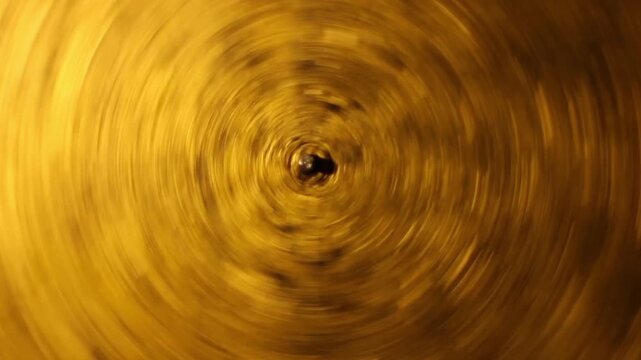golden disk pendulum swinging, abstract moving background