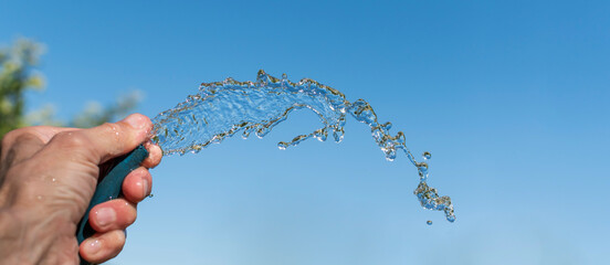 A man pours water from a hose