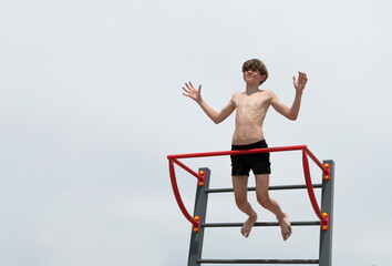 A little boy is engaged in gymnastics equipment