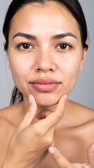 Woman's face, skincare, touching chin