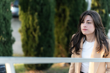 Thoughtful spanish businesswoman looking forward outdoors