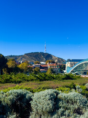 Modern Bridge of Peace Over Kura River in Tbilisi Georgia © EwaStudio