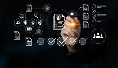 A business professional interacts with a digital interface, showcasing data management and analytical tools through various icons and graphics in a modern workspace. Gantry
