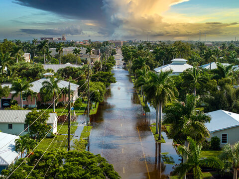 Flooding in Florida caused by tropical storm from hurricane Milton. Suburb houses in Punta Gorda residential community surrounded by flood waters. Aftermath of natural disaster