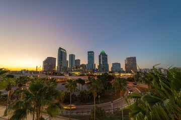Tampa, Florida. Downtown district of American city after sunset with brightly illuminated high buildings and highway traffic. USA travel destination.