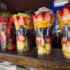Assorted Fresh Berries and Exotic Fruits in Plastic Cups