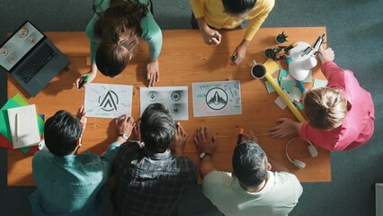 Time lapse of business team write graphic logo on meeting table with colorful sticky notes and design while explain idea. Project manager sharing idea and explain concept art to smart team. Symposium.