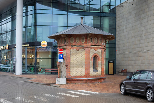 Historic Red and Yellow Brick Hexagonal Artesian Well House in Vilnius, Lithuania