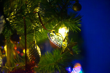 Glowing Heart Ornament and Christmas Tree Decorations in Blue Night Light