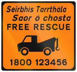 Temporary warning road sign used in Ireland - Free Recovery with phone number in Gaelic and English