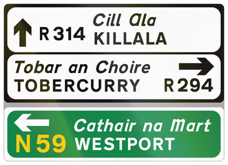 Road sign used in Ireland - Routes to Killala, Tobercurry and Westport in Gaelic and English