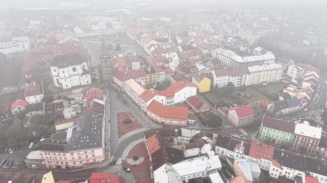 aerial view of historic town center red tile roofs cobblestone streets heritage tourism director filming