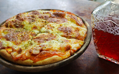 Homemade pizza with ham, sausage, and cheese