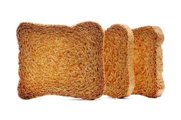 Pile sliced whole wheat dry integral bread with wholewheat flour isolated on white background, side view