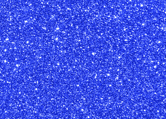 Blue glitter light shining sparkle texture background. Christmas New Year and Celebration background concept.