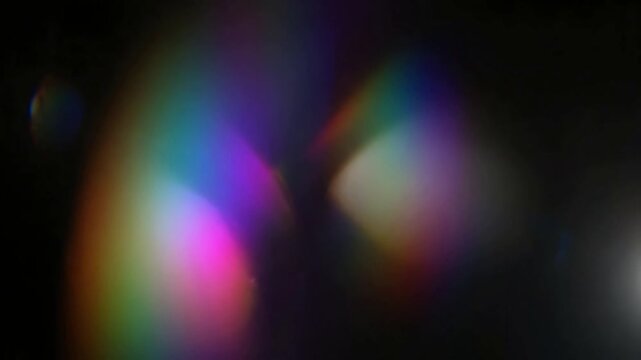 Abstract background with moving colorful rainbow prism light leaks and lens flare overlay effect
