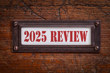 2025 review - a label on grunge wooden file cabinet. A passing year evaluation, summary and review concept.