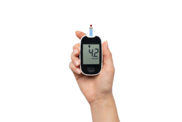 Hand holding blood glucose meter