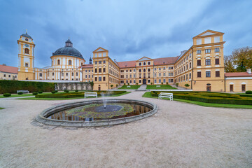 Obraz premium View of Jaroměřice nad Rokytnou Castle with Adjacent Park, Fountain, Benches, and Lightly Clouded August Sky, Czech republic, Moravia