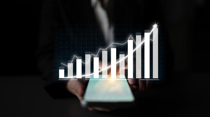 A sleek image featuring a smartphone displaying a business chart with upward trends, set against a dark background, symbolizing modern finance and growth potential. Impute