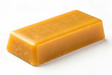 Beeswax bar on white background for natural products. Pure beeswax bar isolated showcasing its rich, golden hue and smooth texture. Ideal for homemade candles or natural beauty products.