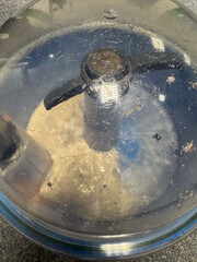 Food processor lid preparing dough in kitchen