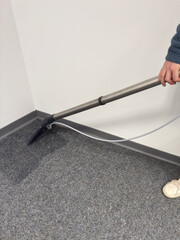 Professional carpet cleaning extraction service in office