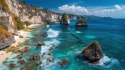 A coastal area in Indonesia featuring rocky cliffs and clear blue water. Small rocky islands are seen in the ocean along with gentle waves.