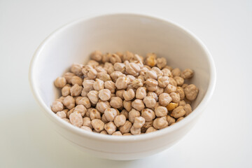 A heap of dried uncooked chickpeas, a healthy source of plant protein