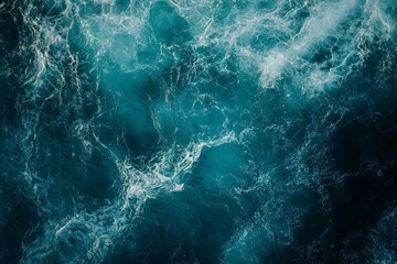 Obraz premium Dynamic aerial perspective captures wild ocean waves with rich blue hues. Turbulence and movement create captivating texture and depth. Neural network AI generated