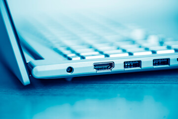 Keyboard of laptop and ports closeup.