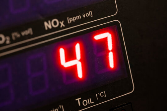 Automotive emissions analyzer display showing nitrogen oxide measurement reading of 47 with temperature monitoring