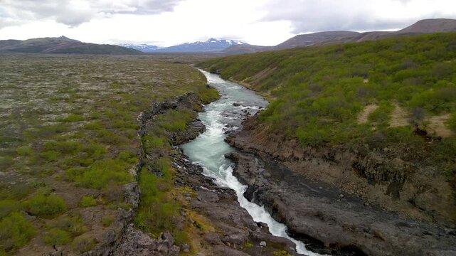 Aerial view of rock formations and erosion at Barnafossar water falls in rural Iceland