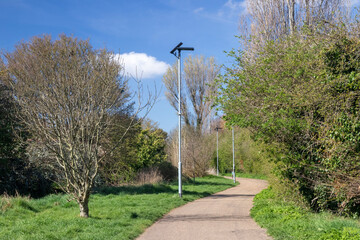 Pathway parallel to the Prittle Brook Greenway, Leigh-on-Sea, Essex, England, United Kingdom, on a sunny spring day.
