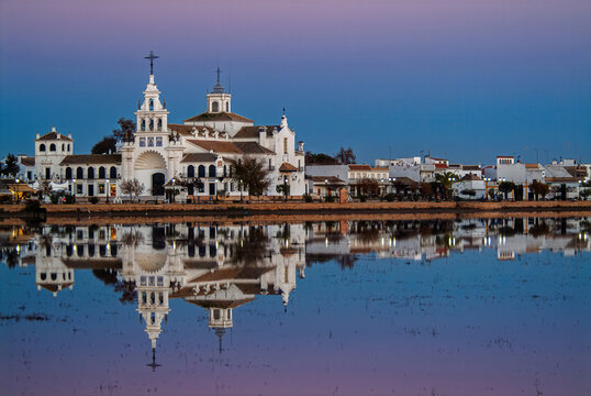 Hermitage of El Rocio reflected in Do&ntilde;ana wetlands at dusk