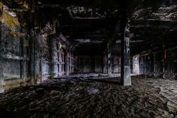 Burnt and ruined interior of industrial building after fire. Consequences of war, fire or other disaster