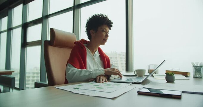 Focused advisor annotates essential strategies diligently at workstation