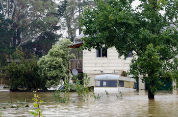 Flood waters surround a farm house near Kawakawa northland  New Zealand