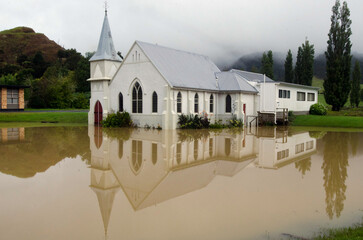 Flood waters surround the Memorial Church in Kaeo Northland New Zealand