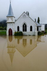 Flood waters surround the Memorial Church in Kaeo Northland New Zealand