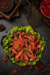 Delicious Spicy Chinese Chicken Wings with Cumin and Fresh Herbs