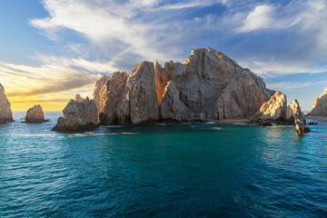 Naklejka premium A small sandy beach and cove at the El Arco Land's End rock formations at the Sea of Cortez at Cabo San Lucas, Mexico.