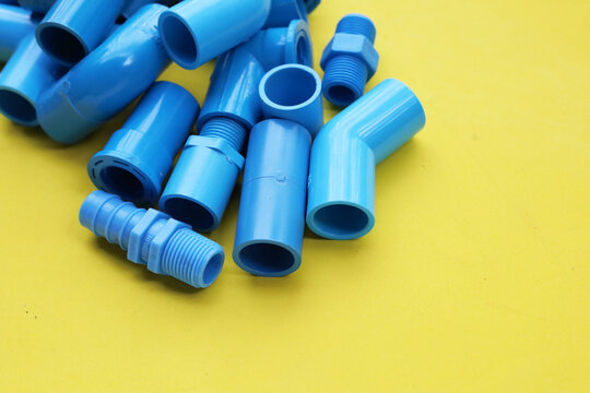 Assorted blue PVC connectors prepared for plumbing and piping work.